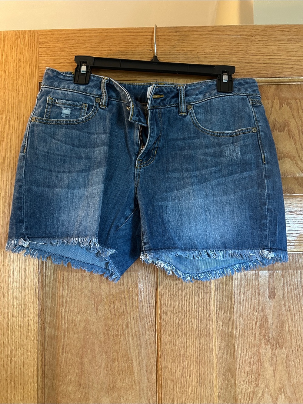 CAbi Distressed Frayed-Hem Denim Shorts in Blue